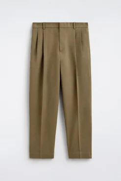 LOCKERE, SCHMAL ZULAUFENDE HOSE MIT FALTEN