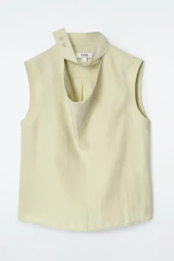 ÄRMELLOSE BLUSE MIT CUT-OUT AM WASSERFALLKRAGEN